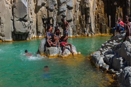 Hamedela, Ethiopia - Nov 2018: Local men swimming in river, Afar region, Ethiopia