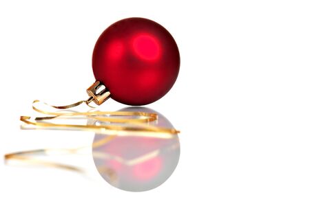 Single red christmas ball, isolated on whiteの写真素材