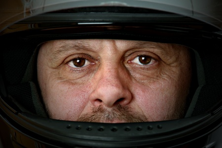 Middle aged man with  motorcyclist helmet の写真素材