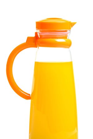 Single pitcher full of orange juice, isolated on whiteの写真素材
