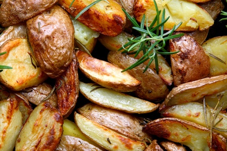 Young baked potatoes with rosemary の写真素材