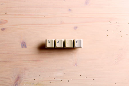 Sale word concept. Flat lay view from above on the table with computer keyboard keys buttons on a...