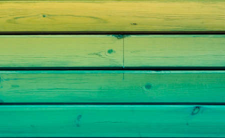 shabby blue paint on yellow boardsの写真素材