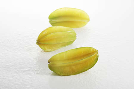 Close up view of the carambola on the whiteの写真素材