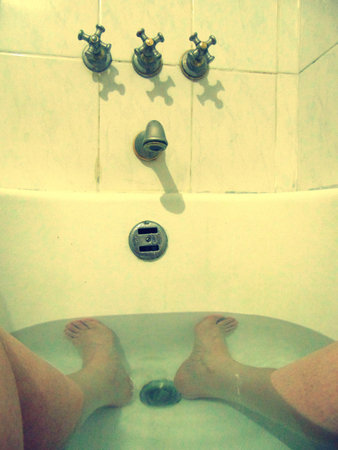 Woman taking a plunge bath