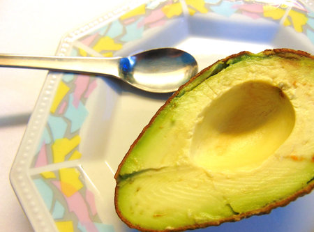 Avocado halfs in a porcelain plate