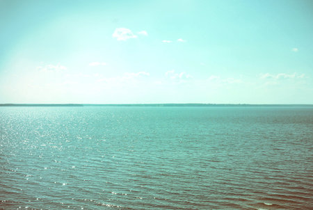 The photograph of the sea surface with the boatの写真素材