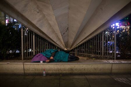 Homeless sleaping under a building at Alexanderplatz in Berlim.のeditorial素材