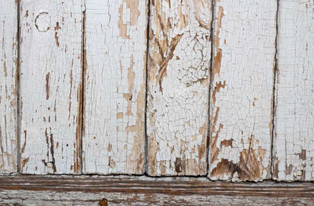Old shabby wooden planks with cracked white color paint. Background.の写真素材