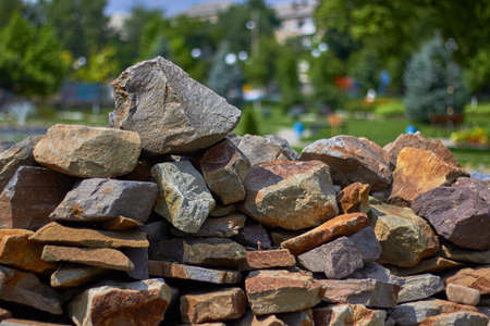Big pile of rocks and stones in the park. Summer time.の写真素材