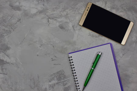 Close up view of notepad, pen and mobile phone on for marble background with copy space for text. Office conceptの写真素材