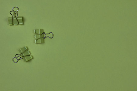 A few paper clips on a colorful background with copy space for text.の写真素材