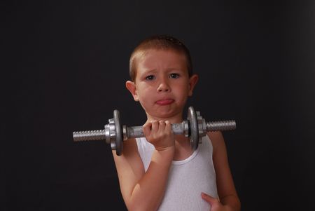 Boy lifting weightsの写真素材