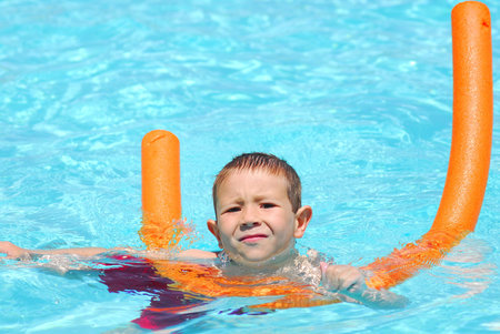 Boy swimming in a poolの写真素材