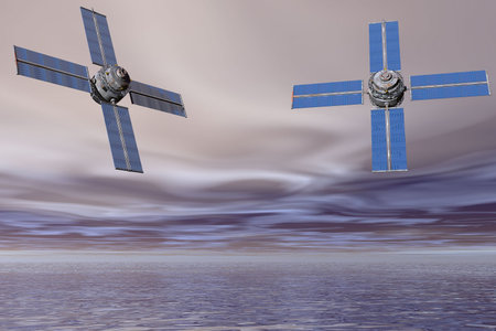 Pair of satellites suspended over the sea