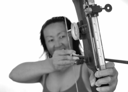 Lovely lady shooting a bow and arrowの写真素材