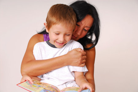 Mother reading to her sonの写真素材