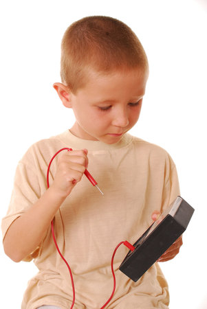 Young boy using a multimeter
