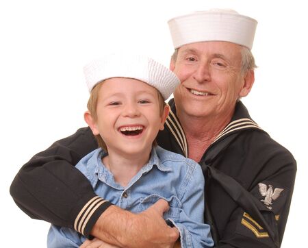Old U.S. Navy sailor with his sonの写真素材