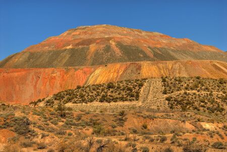 Excavated sides of open pit mine in the desertの写真素材