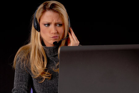 Lovely blond business woman working at laptop computerの写真素材