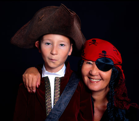 Woman and boy dressed as piratesの写真素材