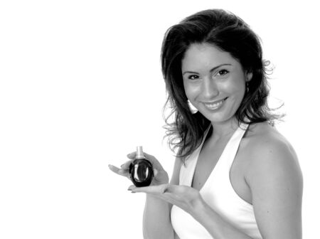 Lovely isolated latina girl spraying on perfumeの写真素材