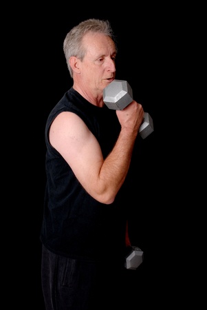 Senior citizen fitness training by lifting weightsの写真素材
