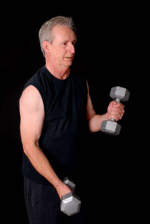 Senior citizen fitness training by lifting weightsの写真素材