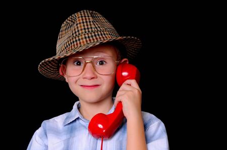 Young boy businessman dressed casually and listening on the telephoneの写真素材