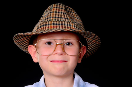 Young boy businessman dressed casually isolated on blackの写真素材