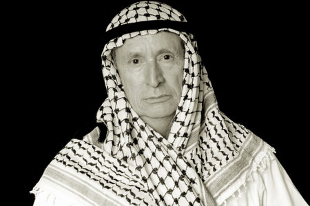 Portrait of an elder arab isolated on blackの写真素材