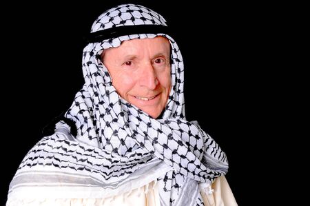Portrait of an elder arab isolated on blackの写真素材