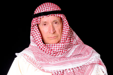 Portrait of an elder arab isolated on blackの写真素材