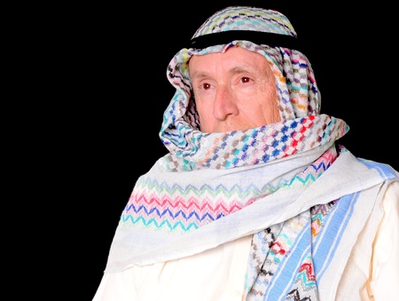 Portrait of an elder arab isolated on blackの写真素材