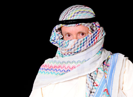 Portrait of an elder arab isolated on blackの写真素材