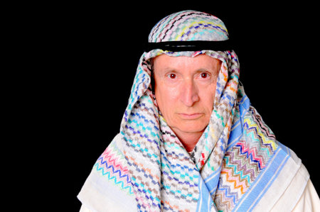 Portrait of an elder arab isolated on blackの写真素材