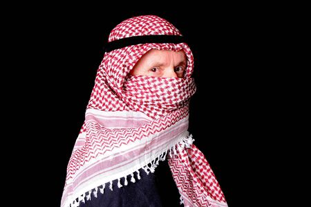 Portrait of an elder arab isolated on blackの写真素材