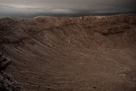 Meteor crater in Arizona with storm approachingの写真素材