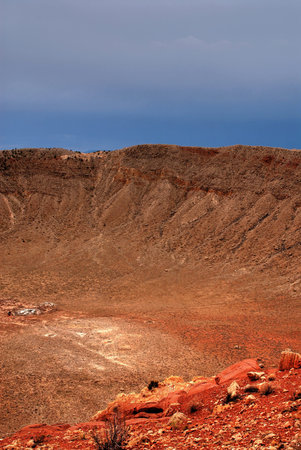 Meteor crater in Arizona with storm approachingの写真素材
