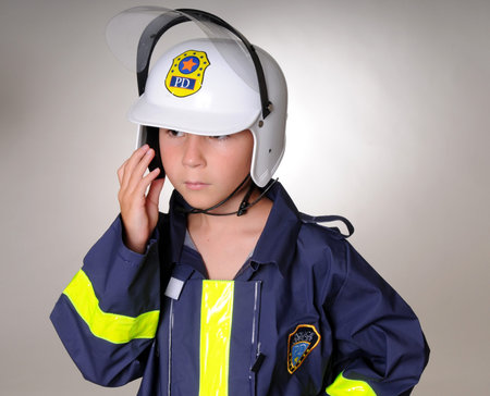 A Young boy wearing a policeman's costumeの写真素材
