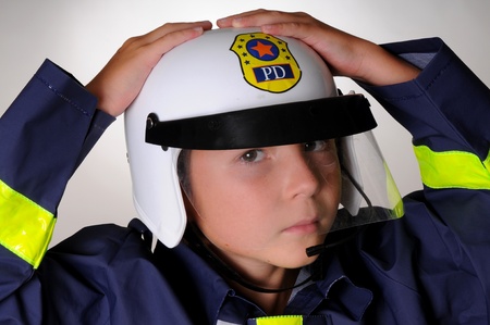 A Young boy wearing a policeman's costumeの写真素材