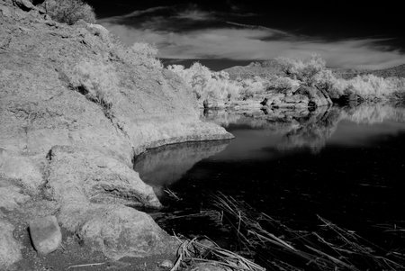 Black and white desert pond and mountainsの写真素材