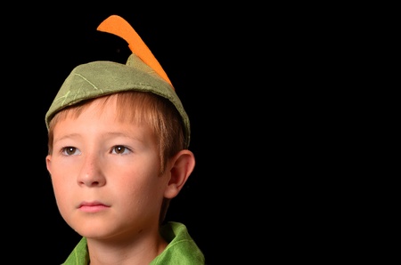 Portrait of a Young boy dressed up in peter pan costumeの写真素材
