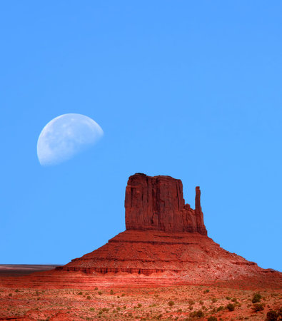 Large moon over Monument Valley Arizonaの写真素材