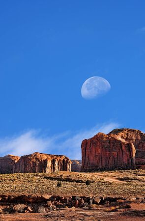 Gibbous Large moon over Monument Valley Arizonaの写真素材