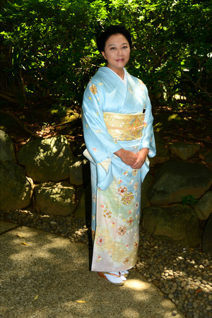 Beautiful Japanese woman wearing a light blue Kimonoの写真素材