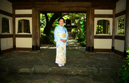 Beautiful Japanese woman wearing a light blue Kimonoの写真素材