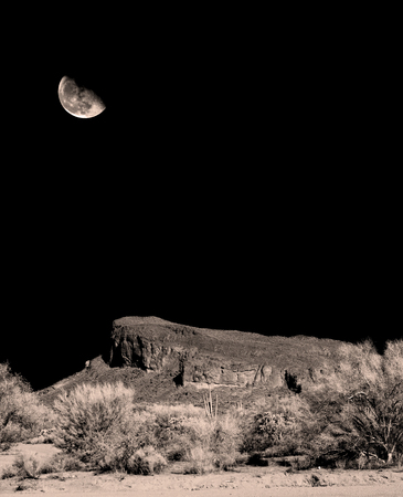 Infrared monochrome desert moon over the southwestern USA Sonora desert Arizona and mountainsの写真素材