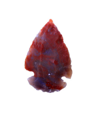 Ancient Prehistoric primitive stone arrowhead isolated over whiteの写真素材